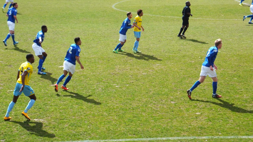 a soccer game is going on in the field