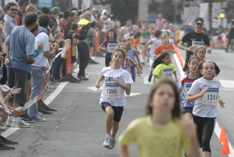 s running in a race, with a group watching them