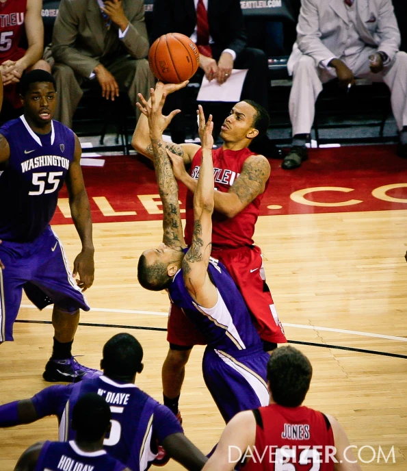 the basketball players are in action in a game