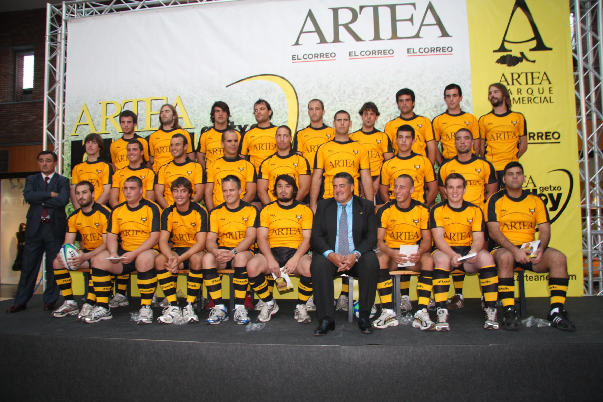 the team of a soccer player posing for a team picture