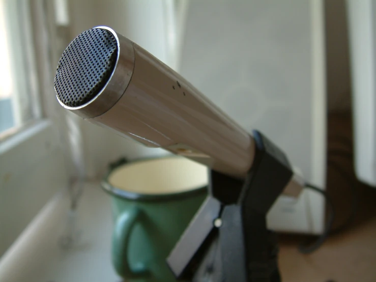 a close up of an old hair dryer in the process of drying