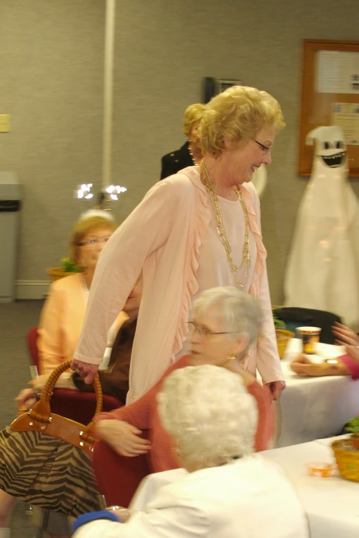 a group of women dressed up and smiling