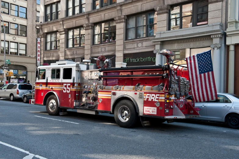 a large fire truck with an american flag on top