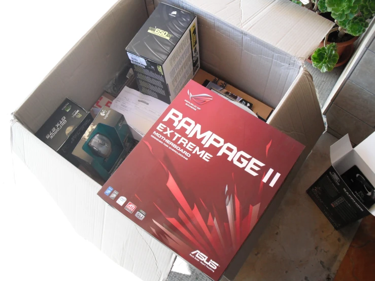 a box with gaming equipment inside and a poster