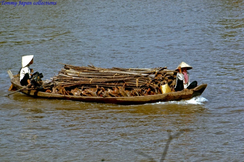 people on small wooden boat in the water