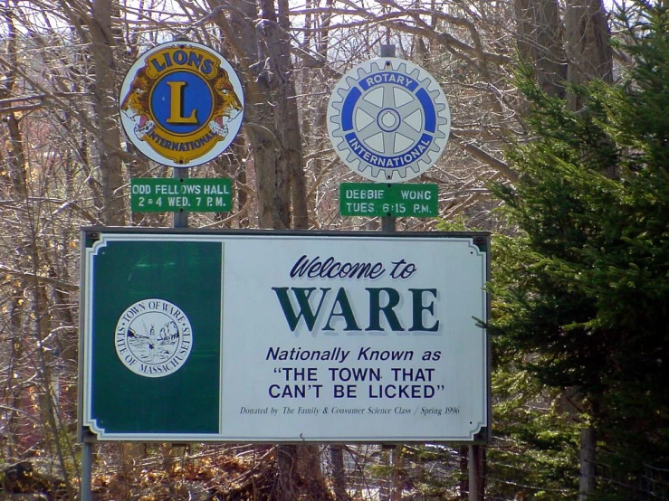 an image of street signs in the woods