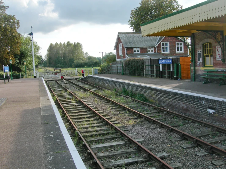 a train platform with several tracks next to it