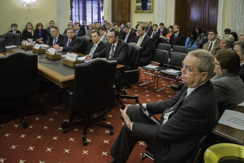 a large group of people sitting at a table