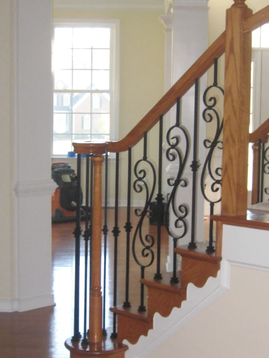 a stair railing is seen from inside a house