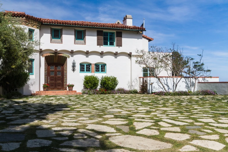 there is a large house with many windows and shutters