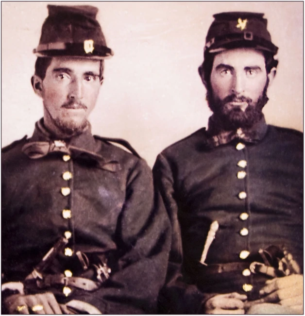 two men in uniforms that have helmets on them