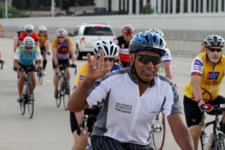 a group of bikers ride down a city street