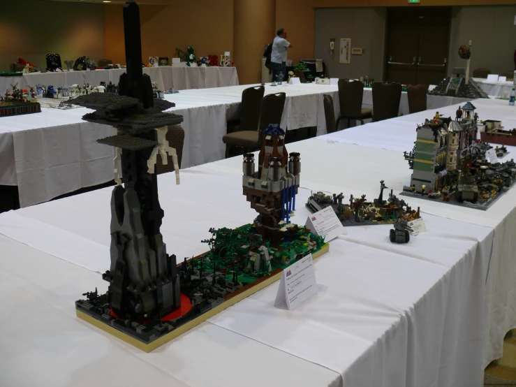 a long table that has some legos on it