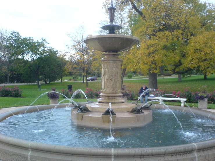 a water fountain that is being used by people