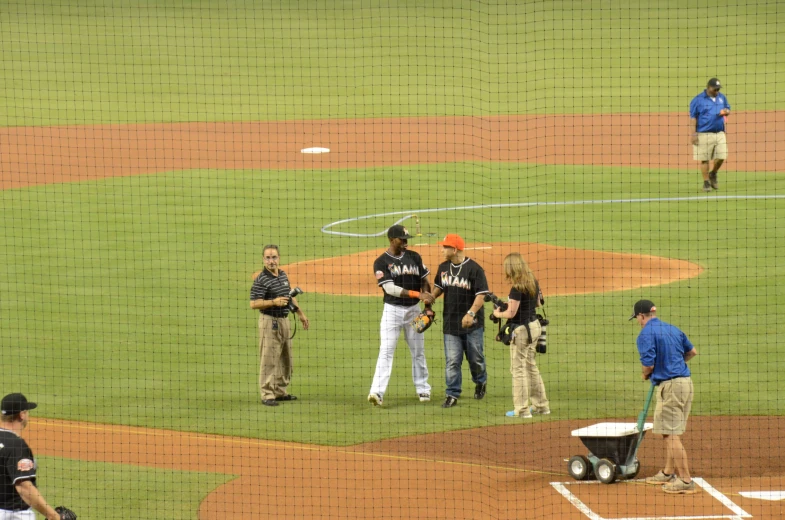 a baseball game in progress with a few players