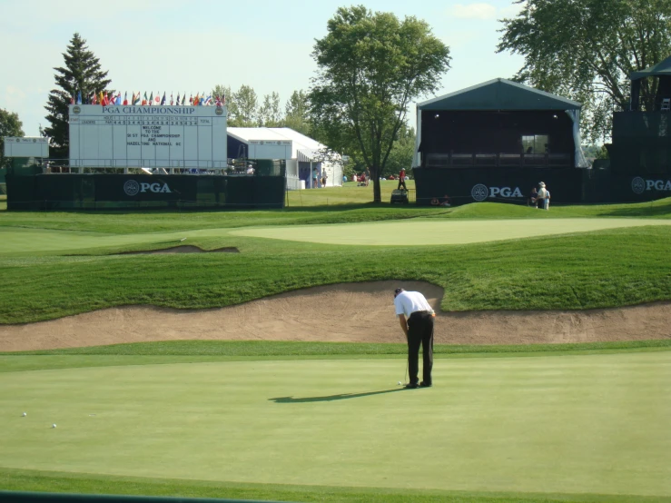 the players is on the playing field playing golf