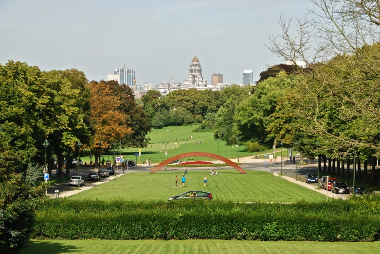 a park with lots of green grass and trees