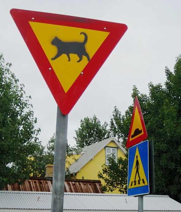 a sign showing a dog or cat on a house