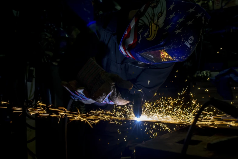 someone  and welding soing on some metal