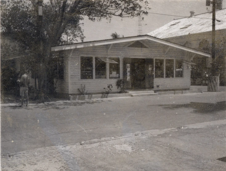 an old po of a small white cottage