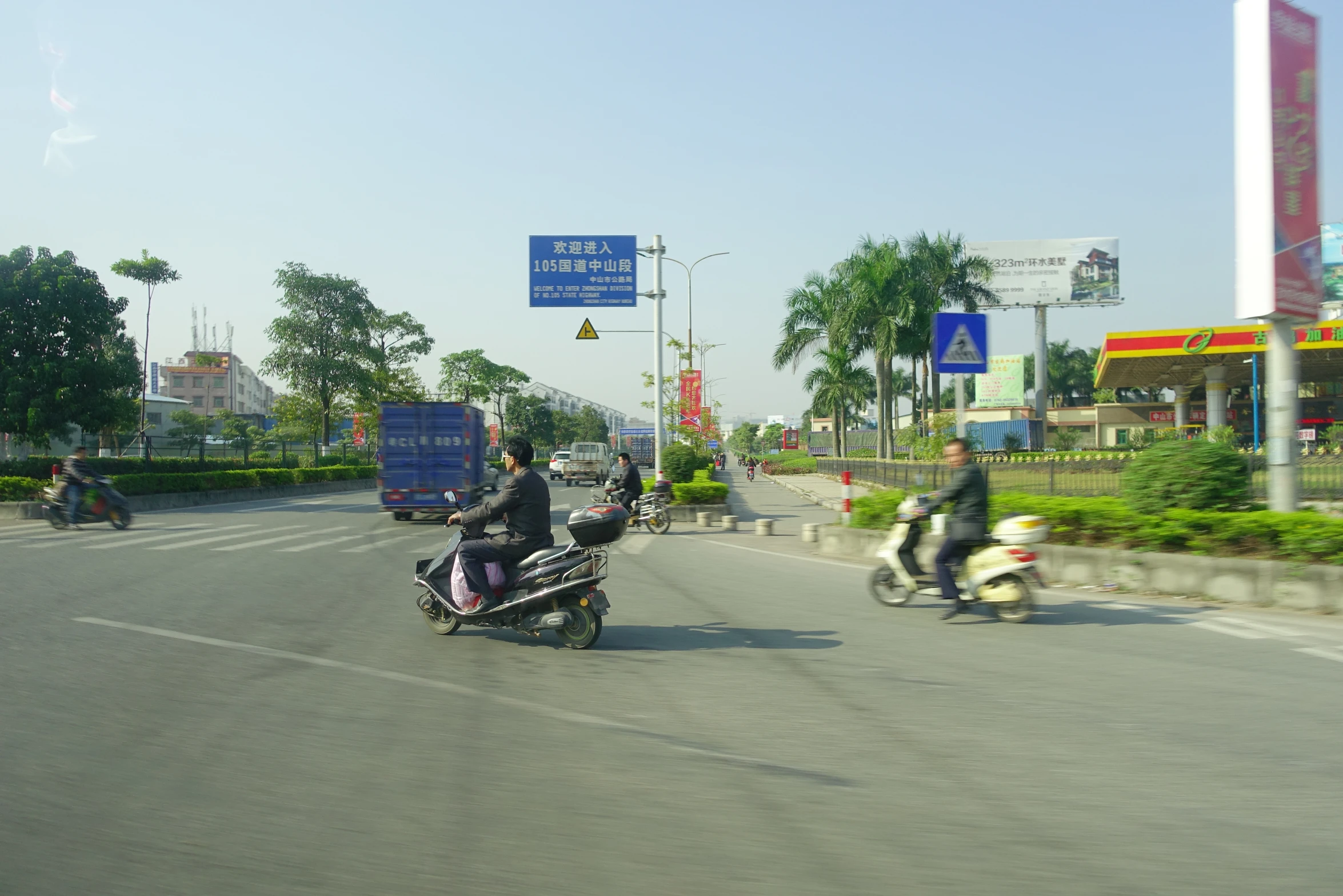 a motorcycle with a three wheeled cart attached to it