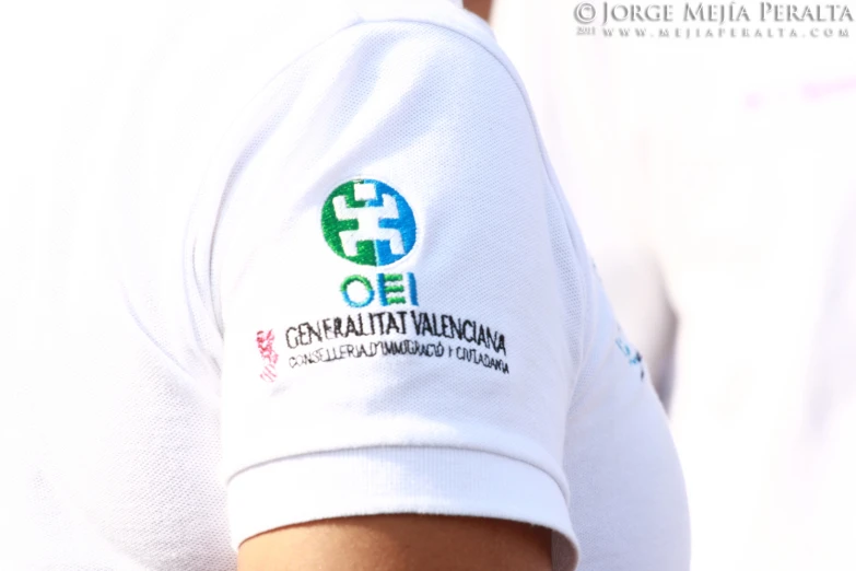 a white shirt with the name of an organization