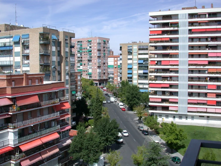 some cars parked on the street near buildings