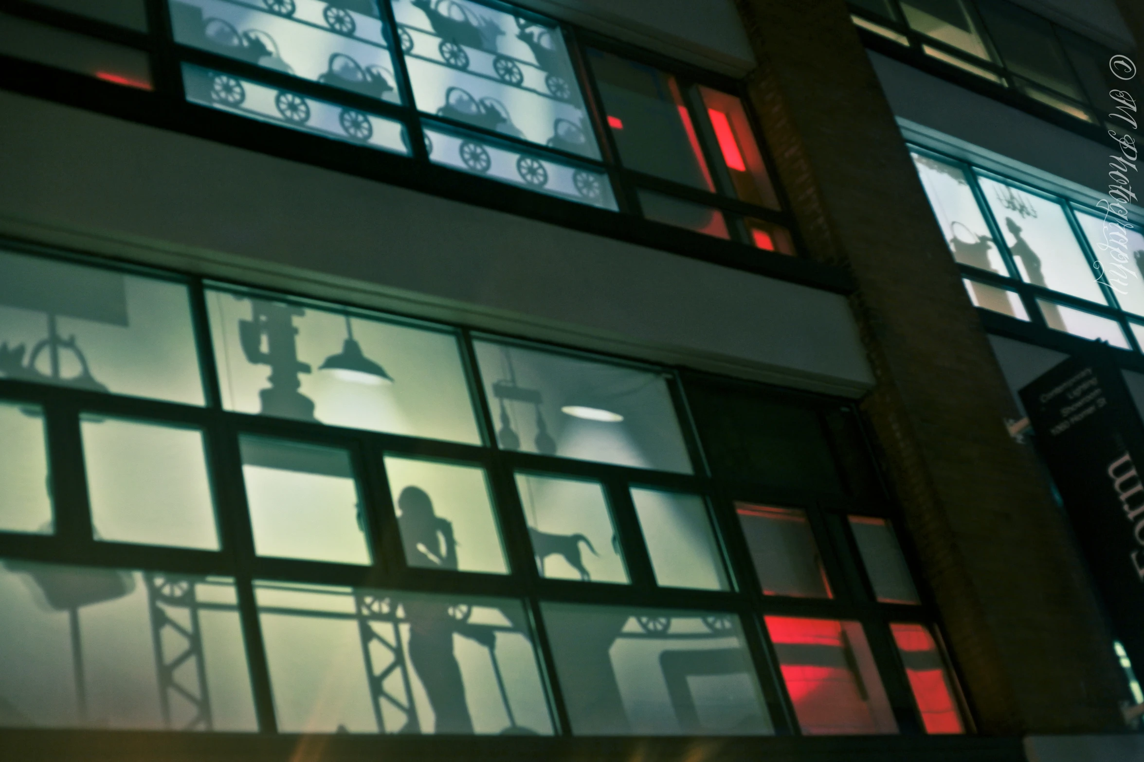 shadows from windows and buildings on a building