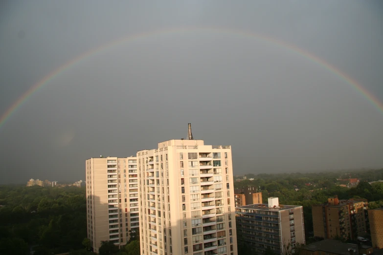 rainbow over a building in the city