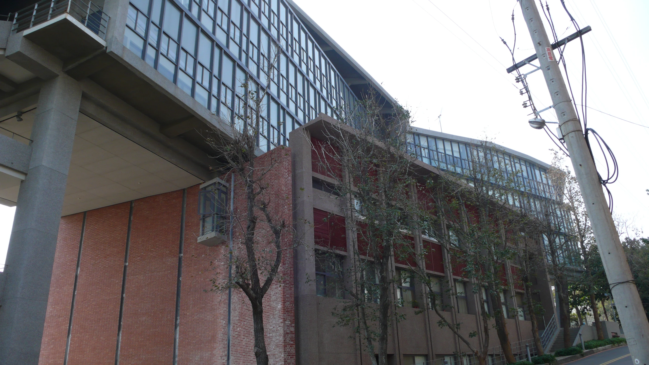 a tall brick building with lots of windows under it