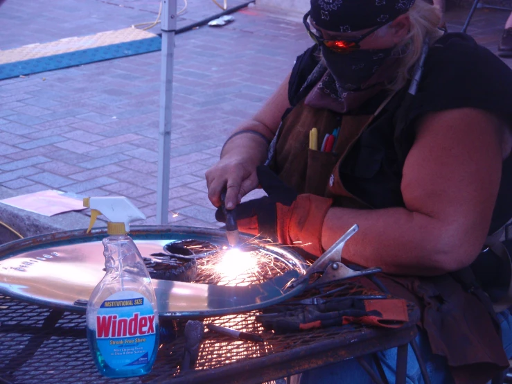 an image of a person working on soing