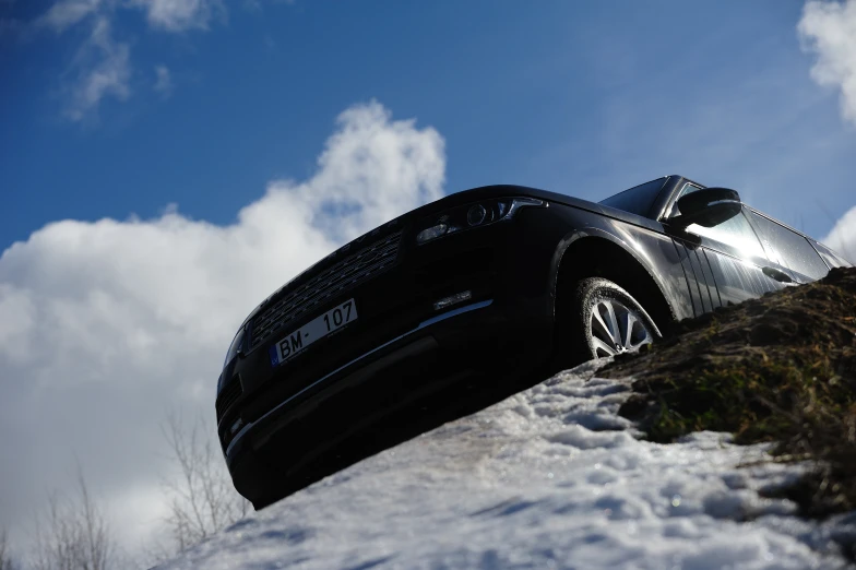 a car is parked on the side of a mountain