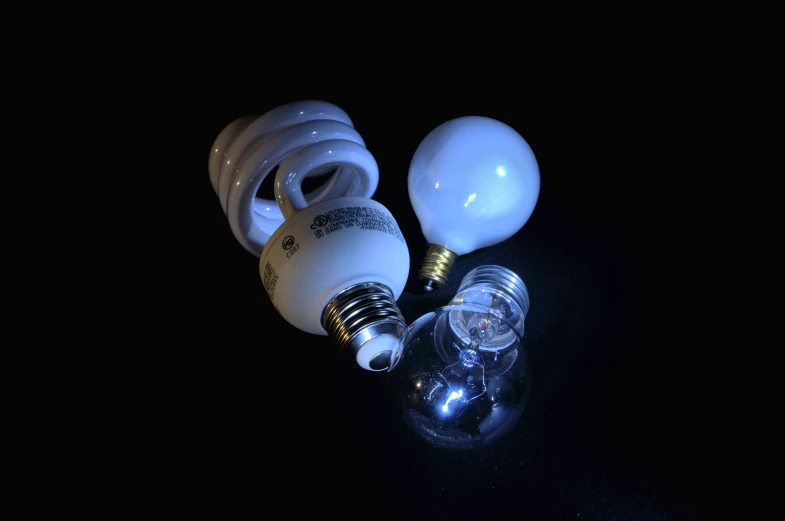 several light bulbs glowing inside and outside on a table