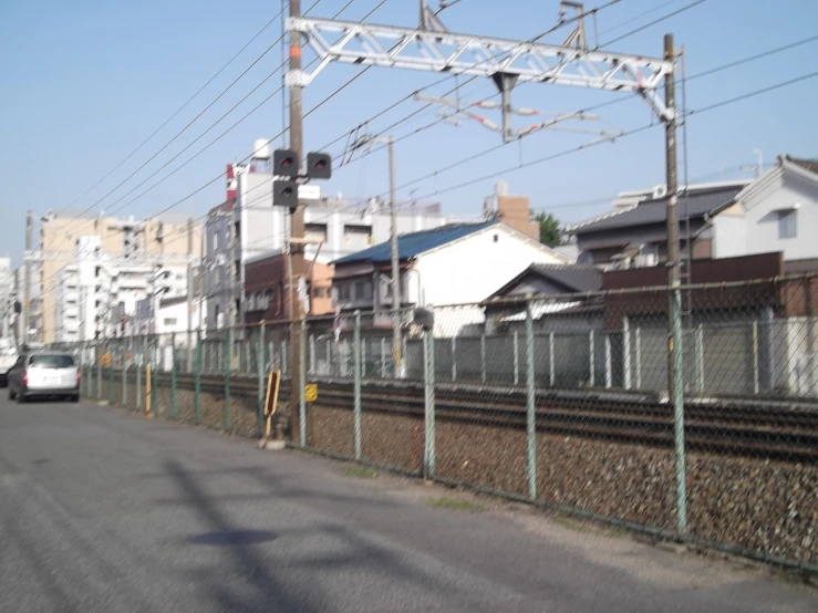 a long rail bridge crossing over a street