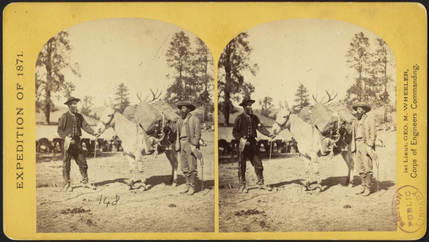 two men with two large horns stand side by side in the middle of a po