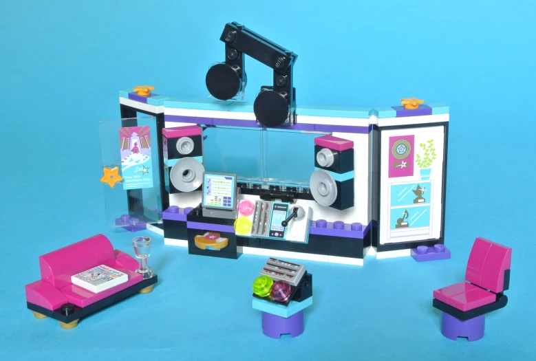 a toy set includes a kitchen, bed and tv