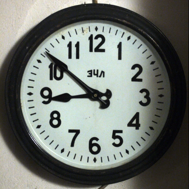 the wall clock is mounted on the wall