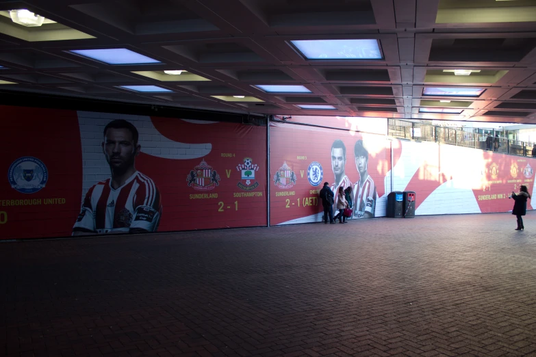 the soccer poster is next to a row of booths