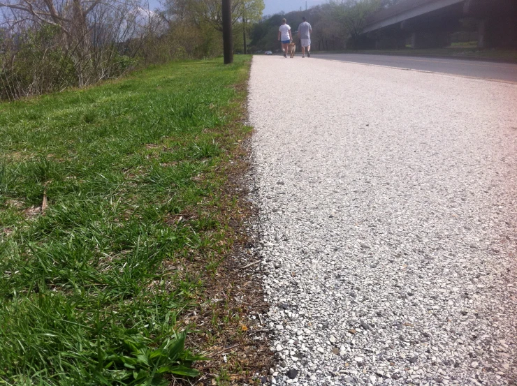 two people walking along the same road to one another