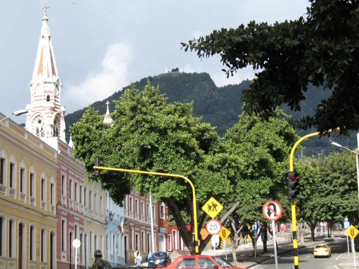 the buildings are painted pink, yellow, and white