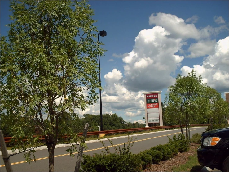 a large sign that says there are two gas pumps