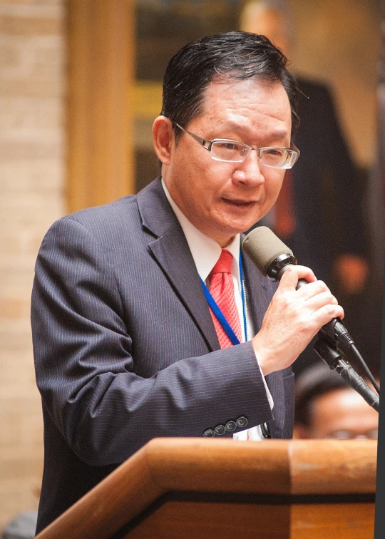 a man giving a speech at a podium