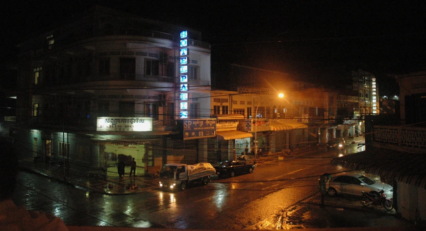 a dark, streetlight filled building at night