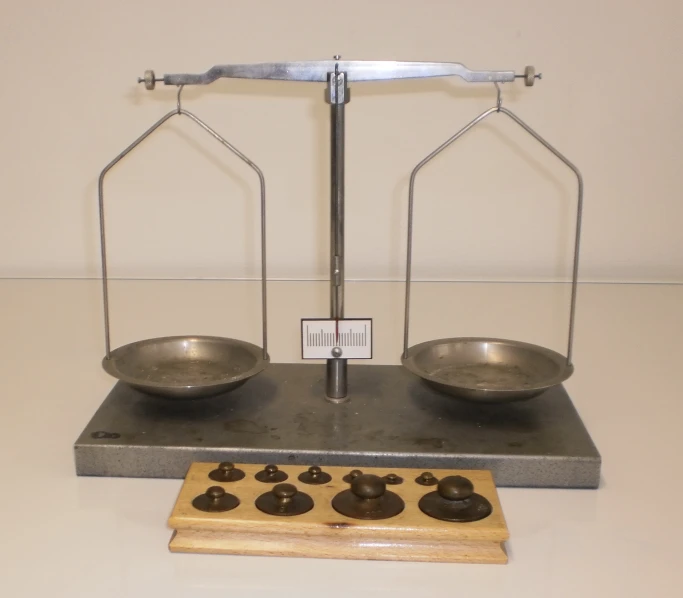 an antique weighing with two bowls on each side