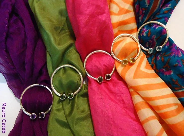 five different colors of ties and rings