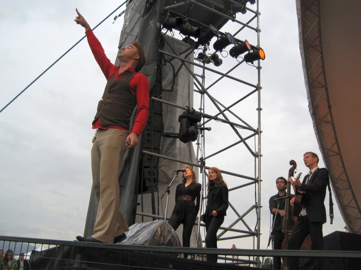 a man is standing on the stage and playing