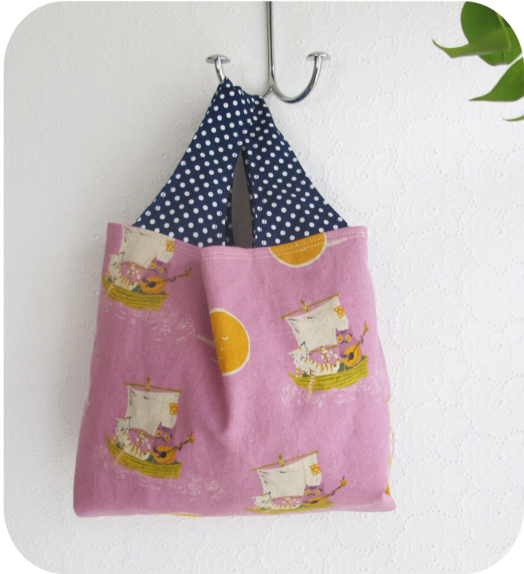 a pink pouch hanging on the wall