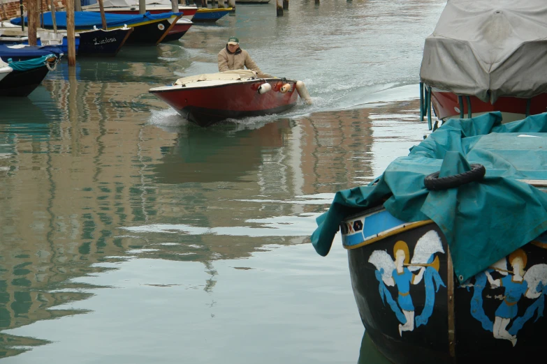 there is a boat with a flag sailing in the water