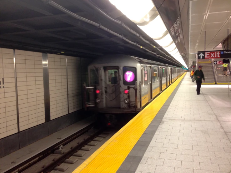 there is a silver subway at the platform