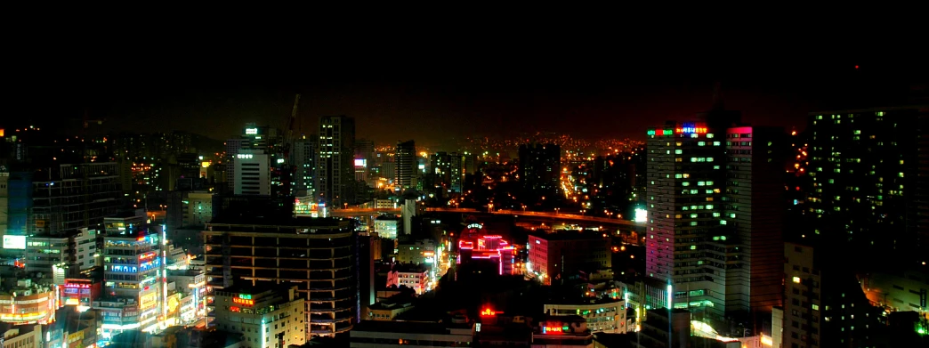 a nighttime view of the city skyline with lights